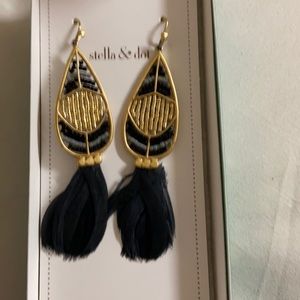 Earrings with black and gold beading and feather
